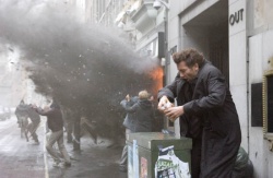 Disillusioned bureaucrat Theo (Clive Owen) tries to avoid a bomb blast | Photo Credit: Jaap Buitendijk - Children of Men