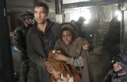 Theo (Clive Owen) and the planets last hope, pregnant Kee (Clare-Hope Ashitey) | Photo Credit: Jaap Buitendijk - Children of Men